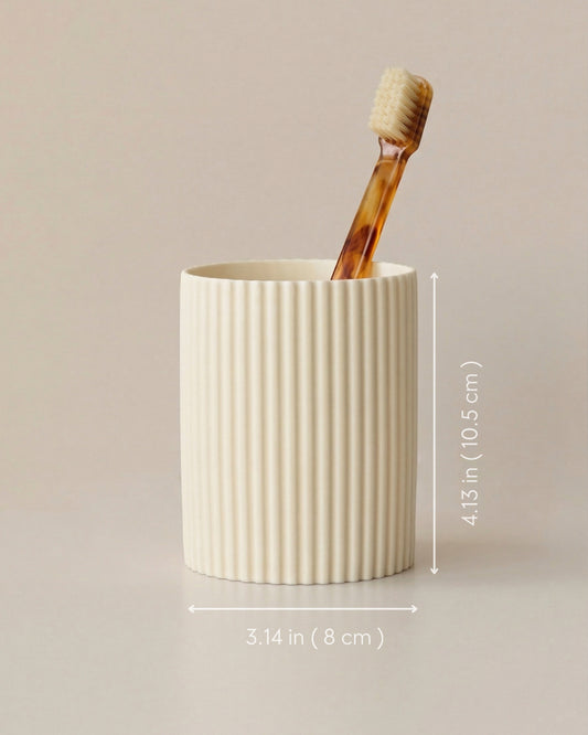 Cream cylindrical pen holder with fine vertical ribbing