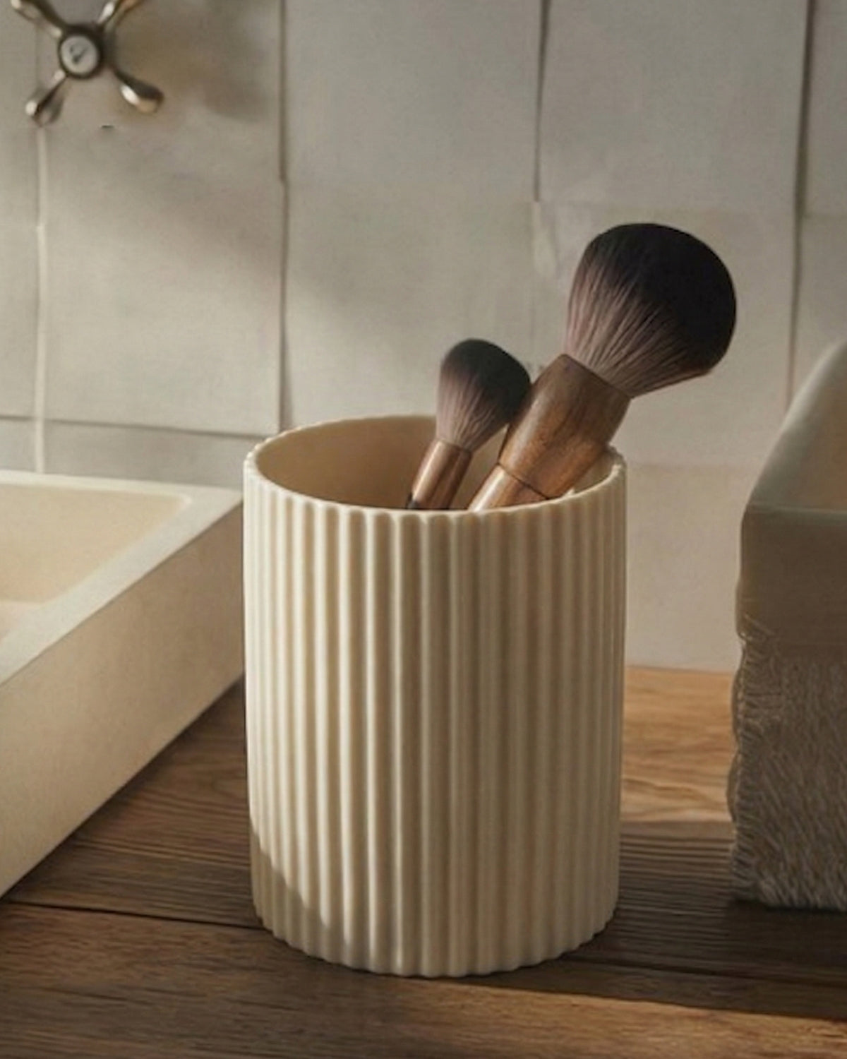 Cream cylindrical pen holder with fine vertical ribbing