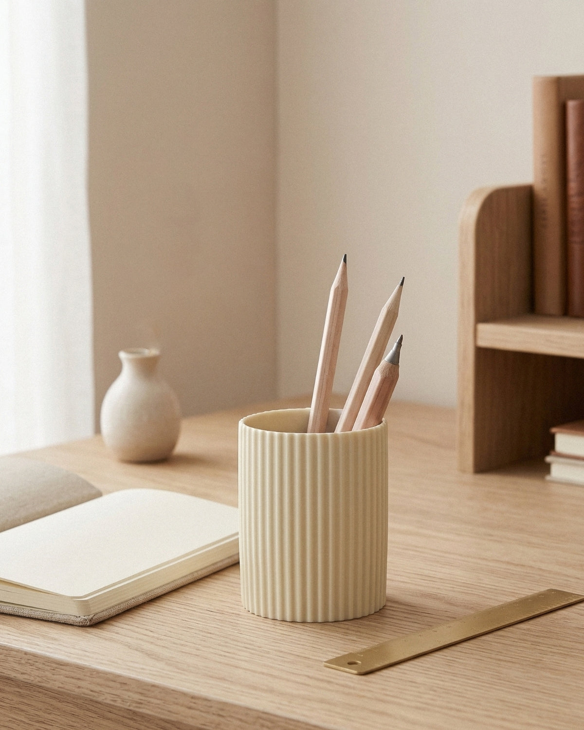 Cream cylindrical pen holder with fine vertical ribbing