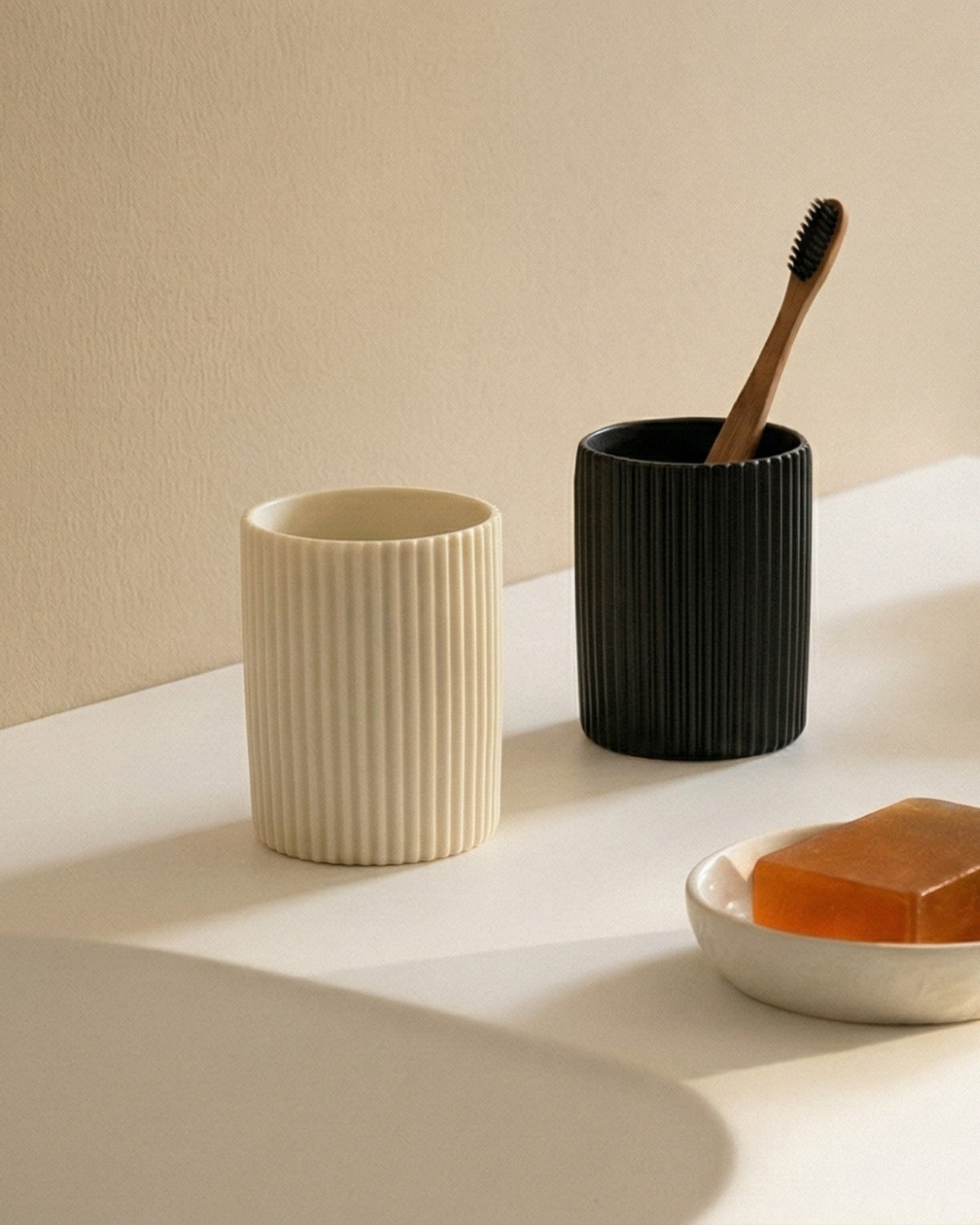 Cream cylindrical pen holder with fine vertical ribbing