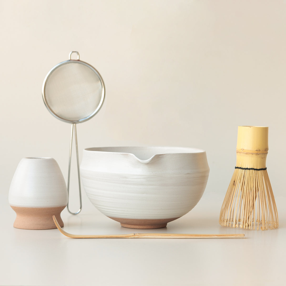 White ceramic matcha bowl with folded rim and pouring spout